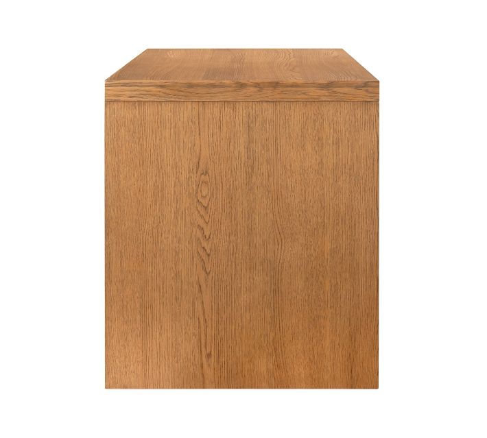Wooden desk pedestal cabinet panel showing natural wood grain.
