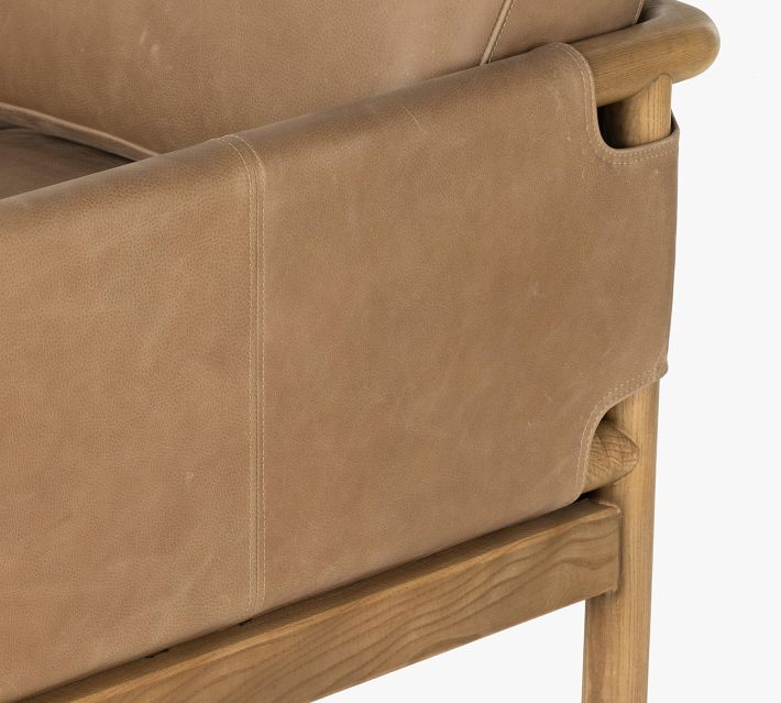 Armchair armrest and side panel in tan leather with wooden frame