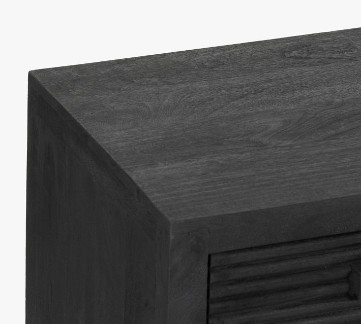 Close-up of dark wood top of cabinet showing wood grain
