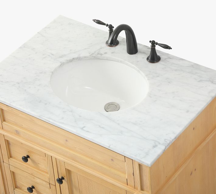 Close-up of marble countertop with faucet