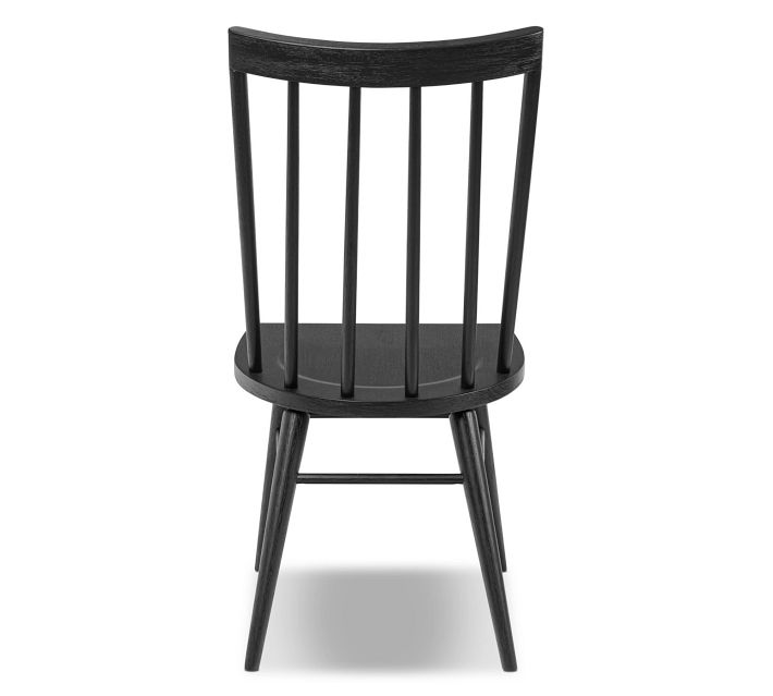 Rear view front perspective of the entire black chair facing camera
