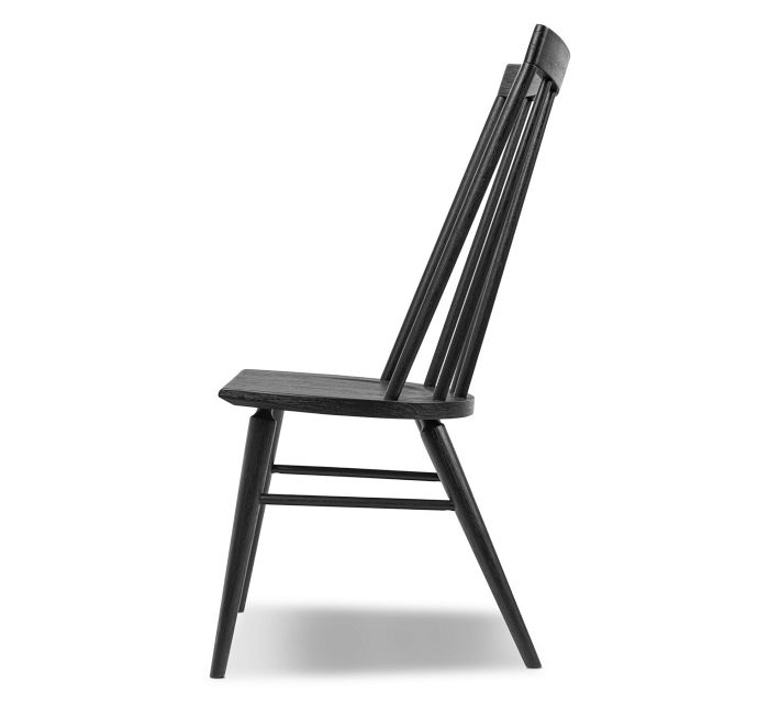 Side view of the chair showing its seat and slender legs