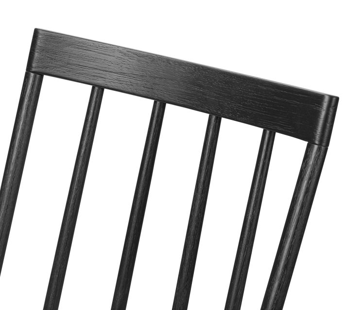 Close-up of the top rail of the chair back showing the wood grain