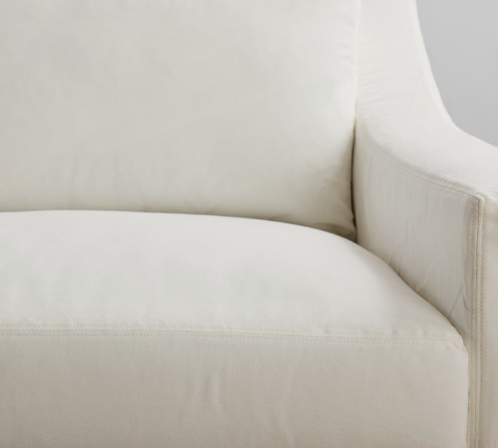Close-up of the seat cushion and arm of the sofa.