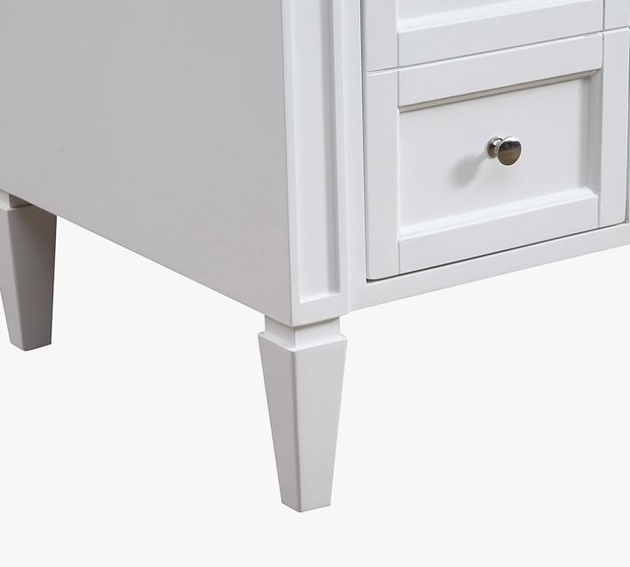 Close-up corner of vanity showing leg and lower panel