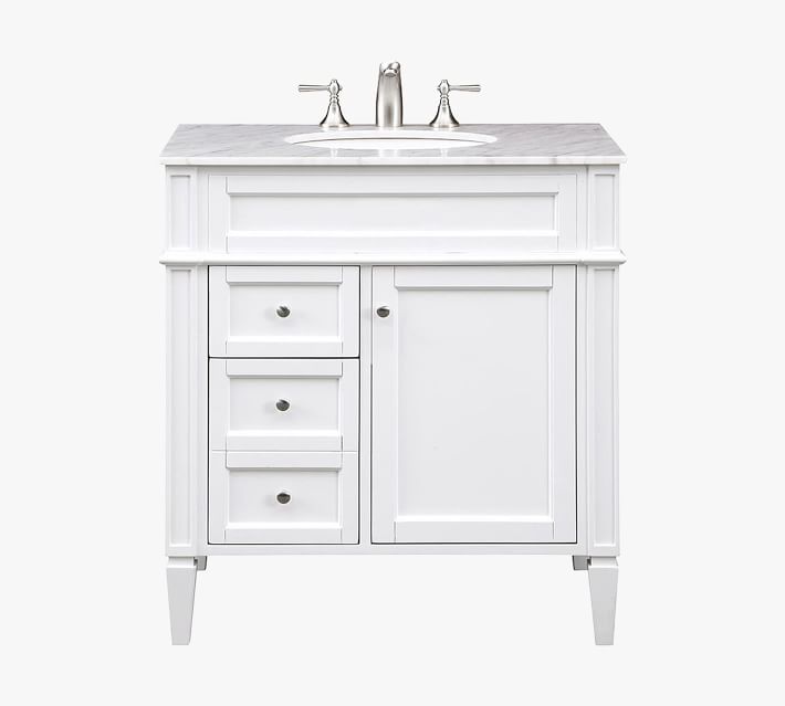 White vanity with marble top and multiple drawers and cabinet doors