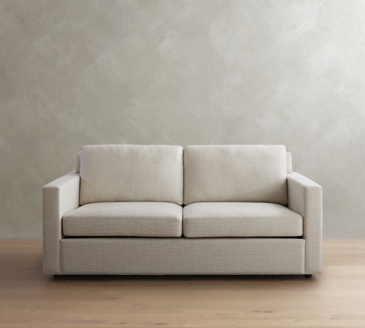 Light beige two-seat sofa with clean lines and cushions