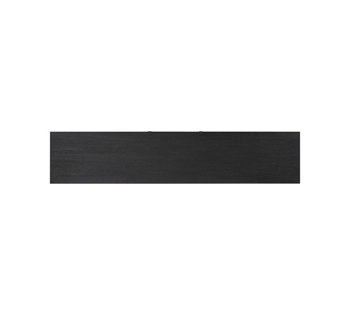 Close-up of the edge of the dark wood cabinet with wood grain texture