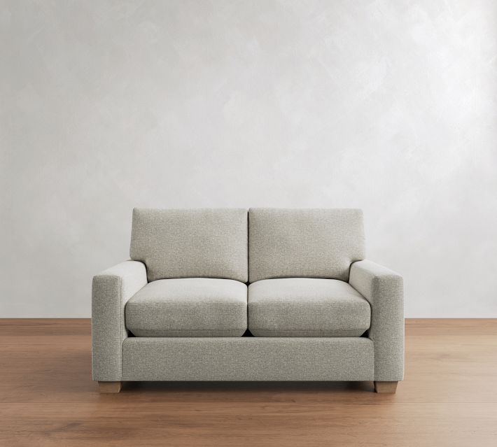 Two-seat light gray sofa with two cushions and armrests
