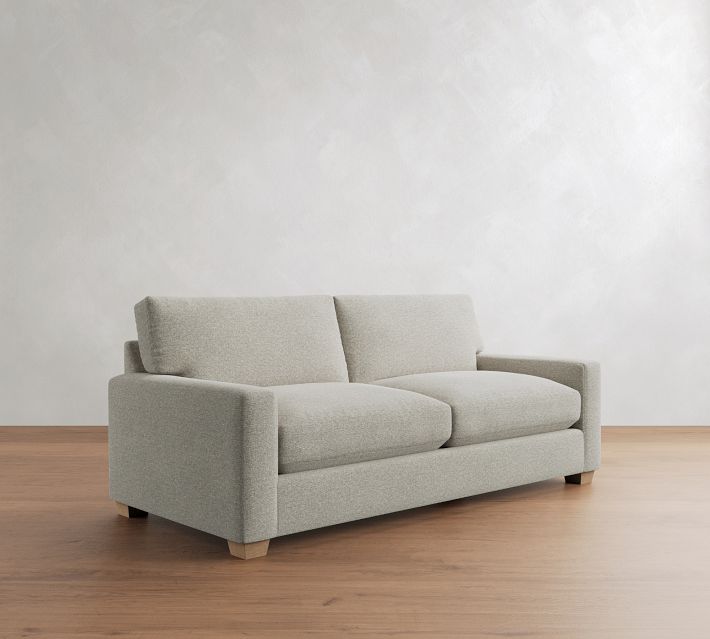 A light gray loveseat sofa with two seat cushions and wide armrests