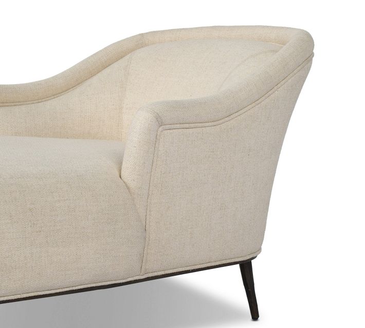 Side view of beige chaise with armrest and legs