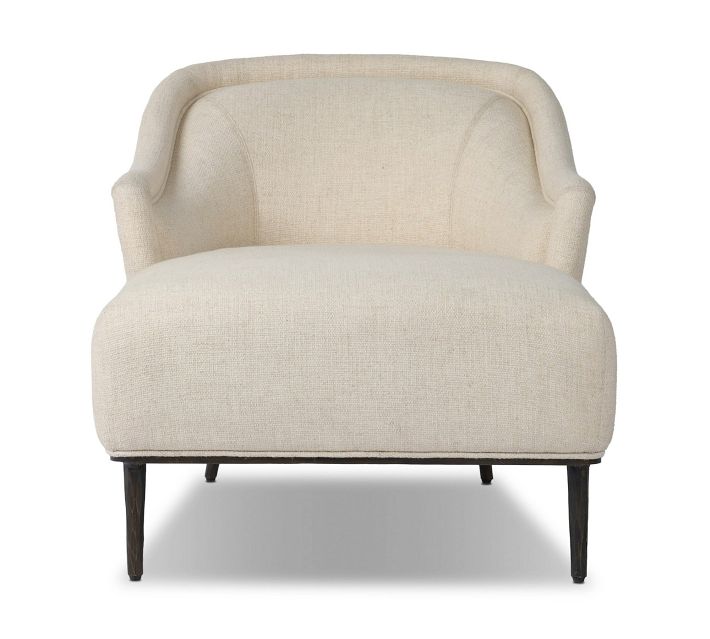Beige upholstered armchair with rounded back and dark wooden legs, shown front-on