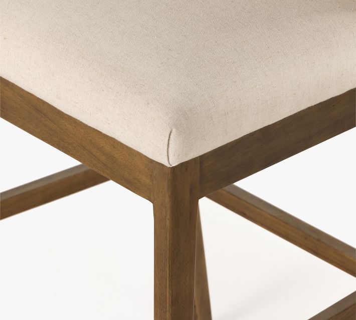 Corner of chair leg and stretcher showing wood finish