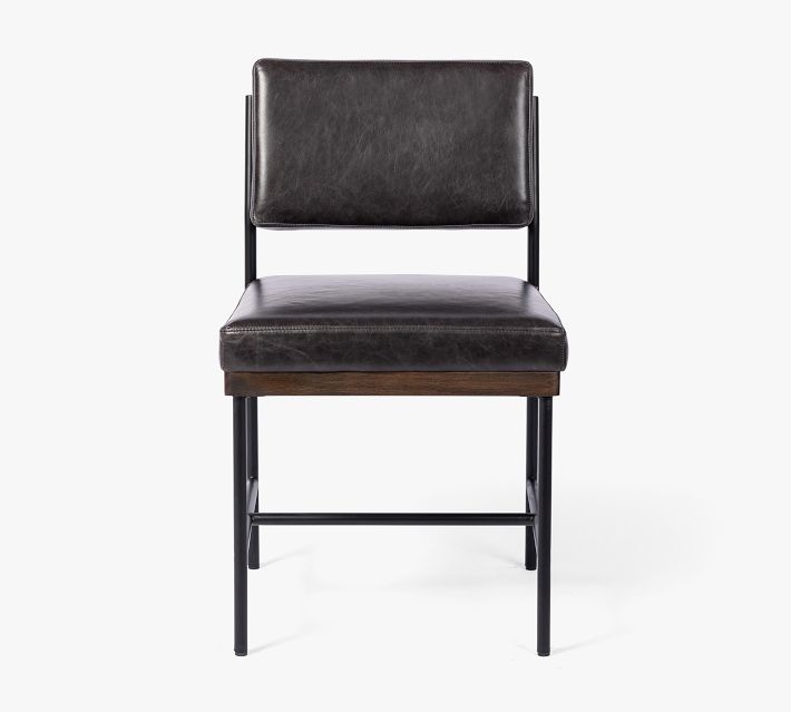 Black leather chair with metal frame and wooden accents, front view.