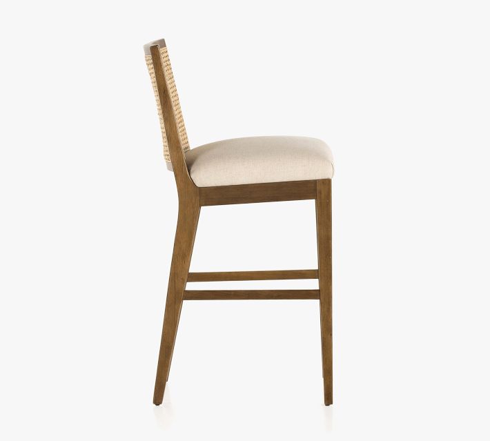 Back view of the bar chair showing cane back and legs