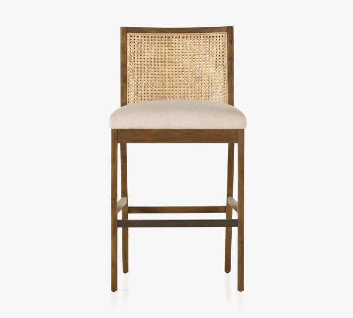 Front view of a wooden bar chair with cane back and beige upholstered seat