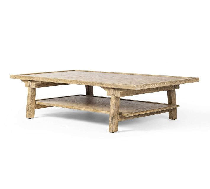 Close view of a wooden coffee table silhouette from the side, highlighting its simple rectangular top and thick legs