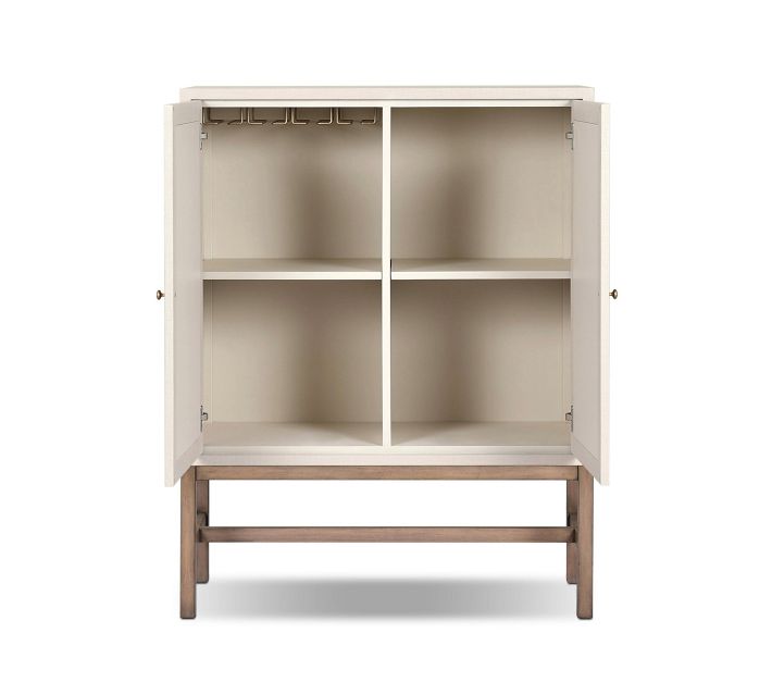 Interior view of cabinet with two shelves and divided sections.