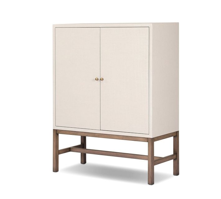 Cream cabinet with two doors and wooden stand in front view.