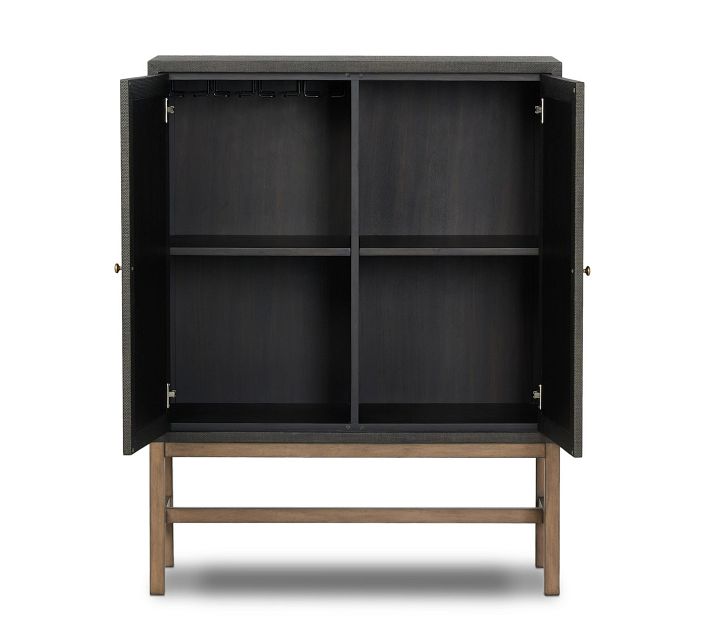 Open interior of cabinet with two compartments and a hanging rod on top.