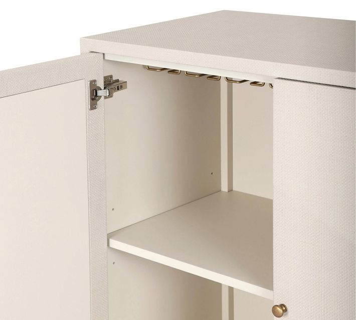 Interior showing hanging rack and upper grid hooks inside cabinet.