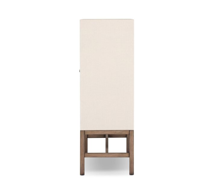 Tall slim cream cabinet with wooden base viewed from side.