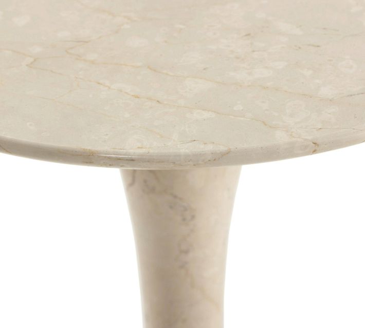 Top view of beige marble tabletop showing surface texture and veining.