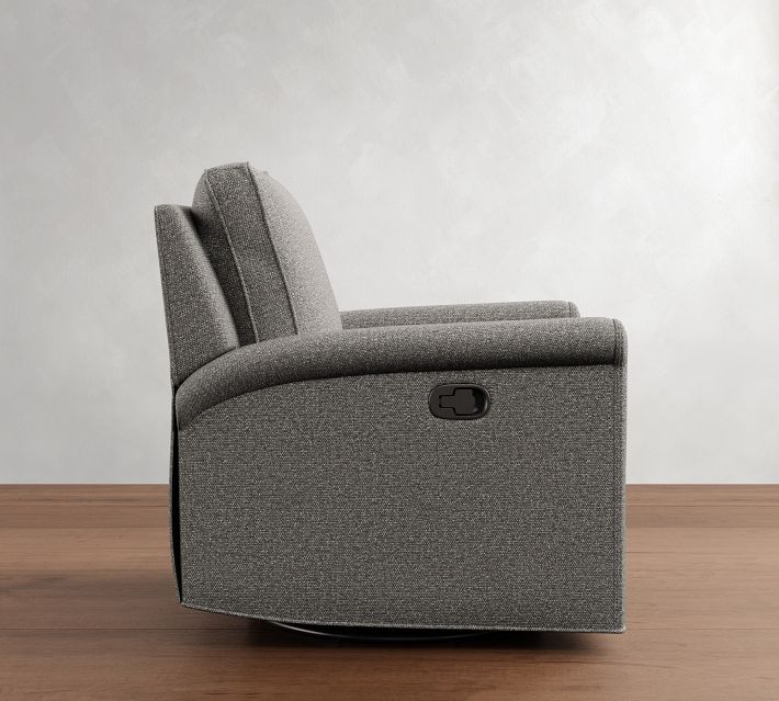 Side view of a gray upholstered recliner chair with a footrest partially extended.