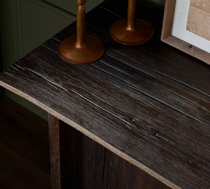 Close-up of dark wood tabletop showing weathered texture and grain