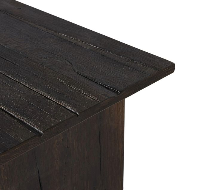 Corner/top edge of dark wood tabletop with beveled edge