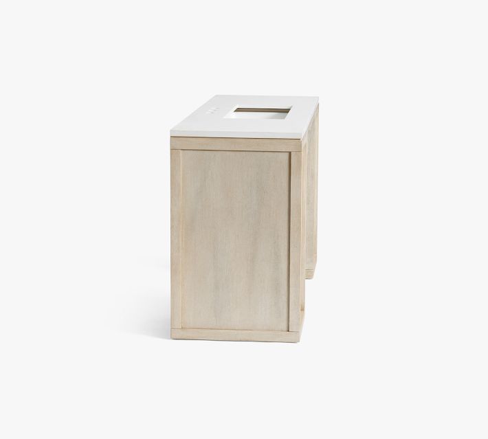 Narrow angled view of a small freestanding wooden trash can or side accessory.