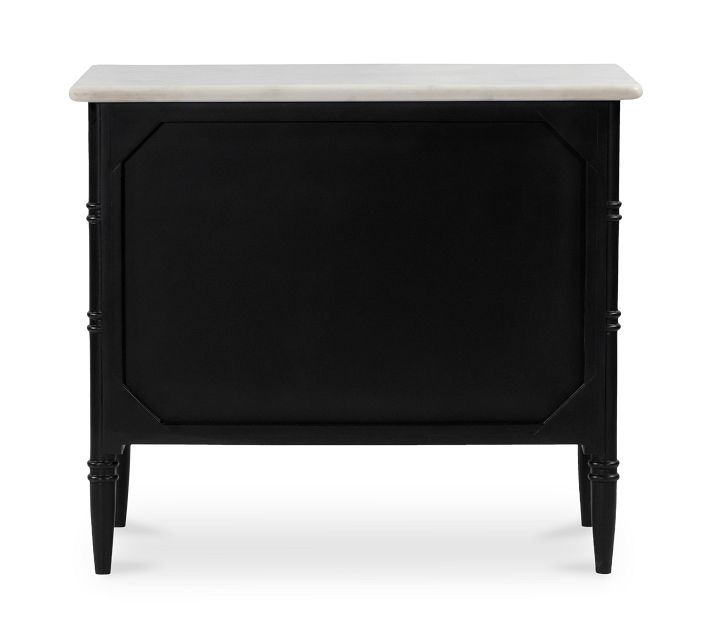 Full view: black nightstand with white marble top and three drawers.