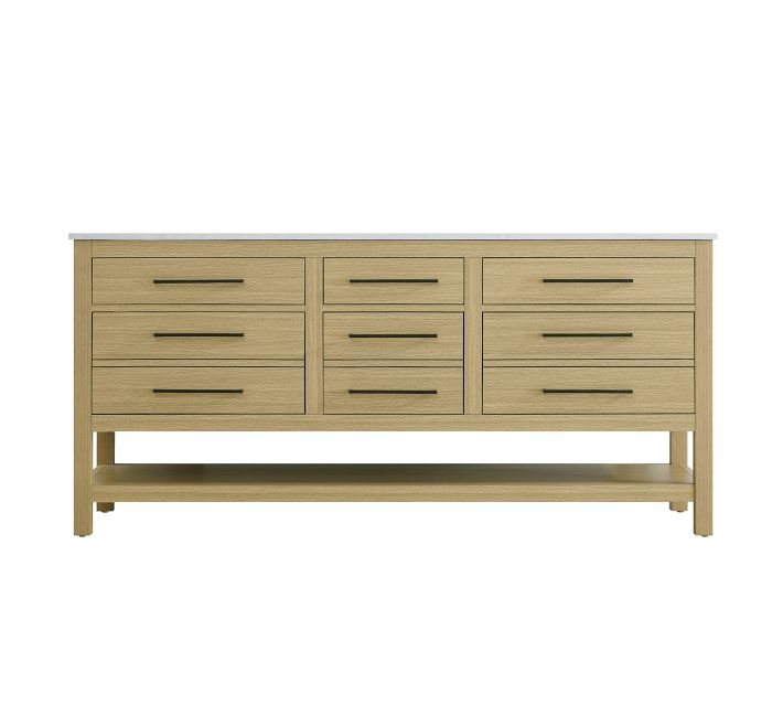 Wide view of a complete vanity with multiple drawers and open lower shelf.