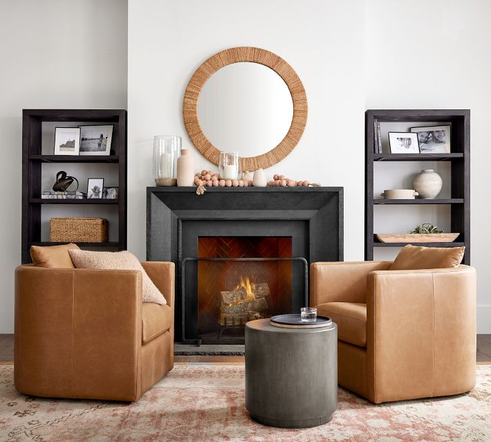 Modern fireplace setup with dark shelves and decor