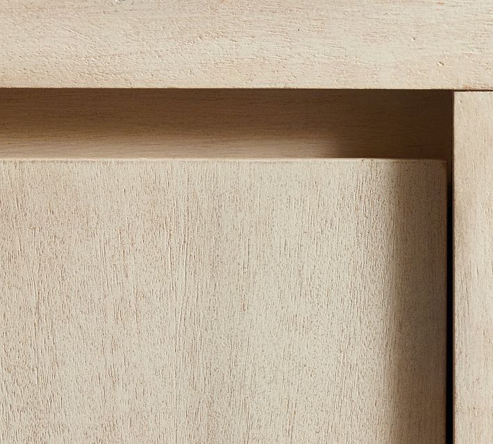 Close-up of the wooden cabinet door with wood grain texture.