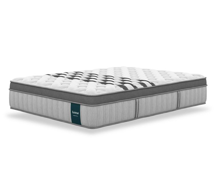 Side perspective of a Leesa mattress showing white top and gray body with teal label
