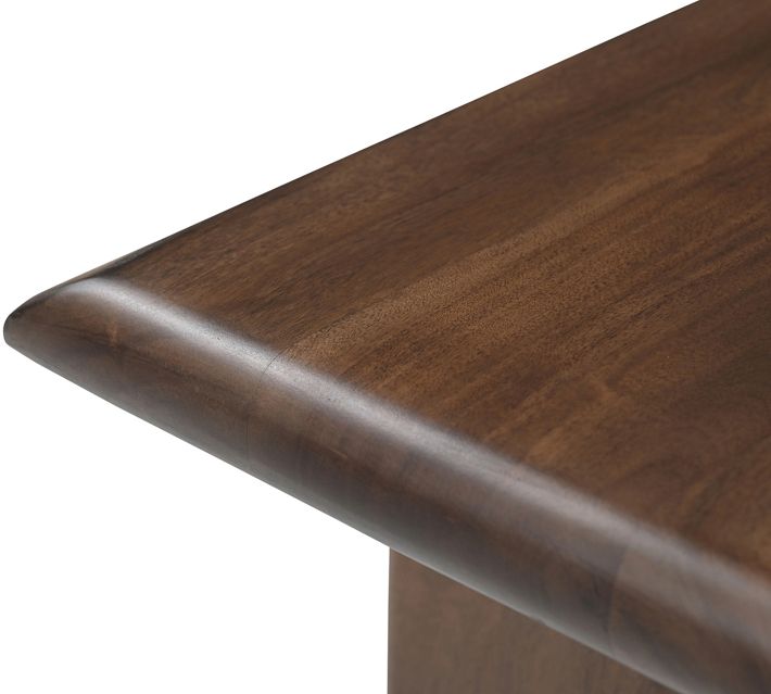 Close-up of rounded edge and grain detail on bench top.