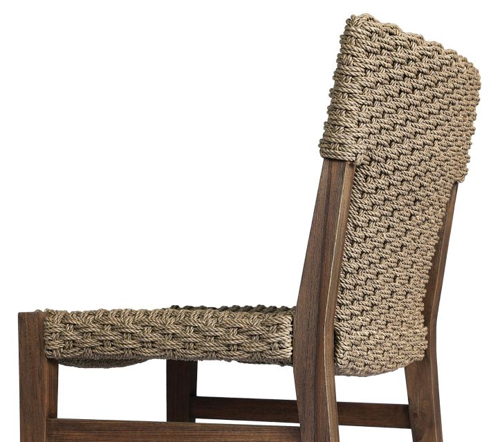 Angle of side chair with woven back and chair back visible