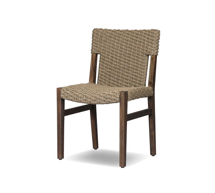 Full view of a woven rattan chair with wooden frame