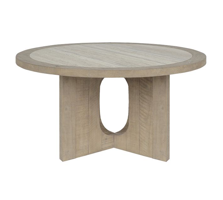 Round wooden dining table with a thick circular top and a pedestal base with an oval cutout