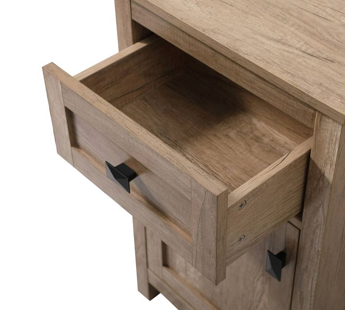 Open drawer of the wooden nightstand showing interior, light wood finish