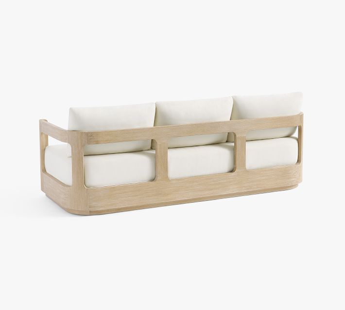 Three-seat sofa with white cushions and a wooden frame, viewed from the side