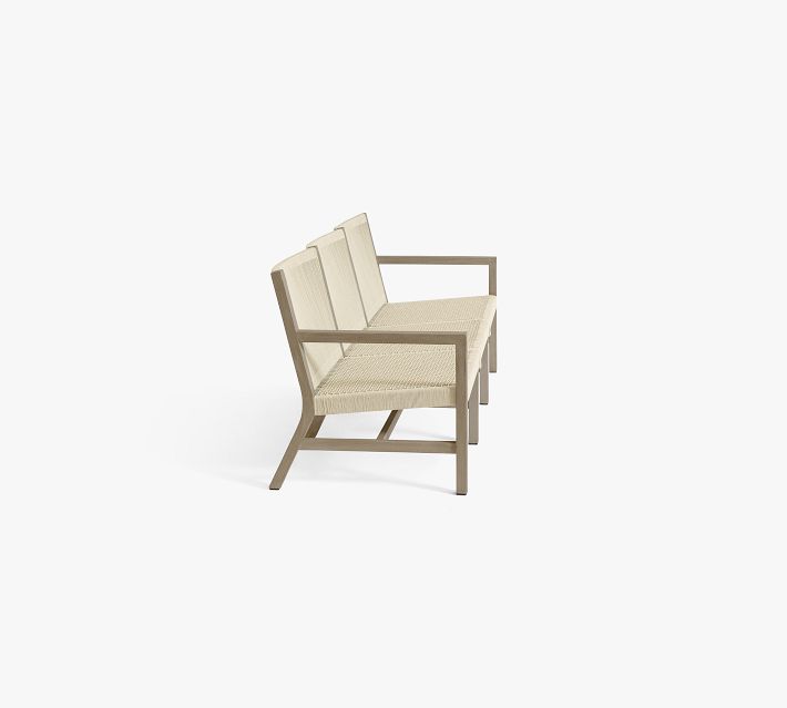 Three-seat outdoor sofa from a side angle focusing on left arm and section join.