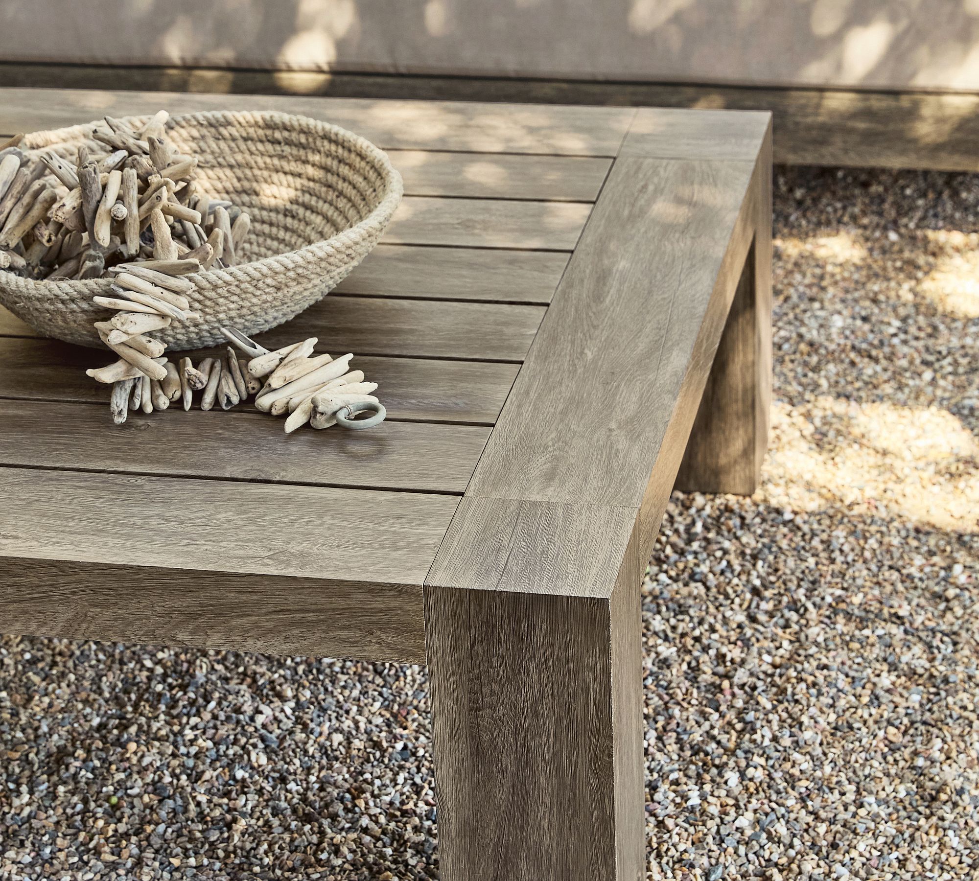 Coffee table edge and woven bowl on table