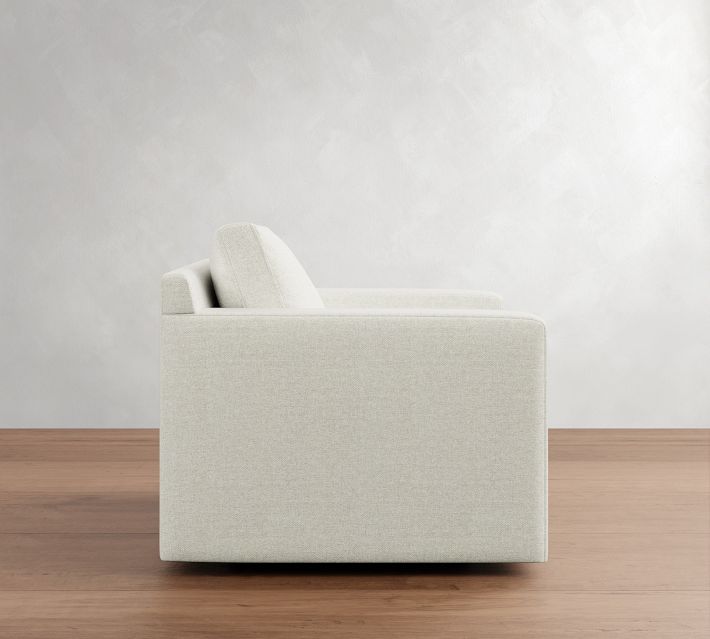 Side profile of an armchair showing armrest and length.