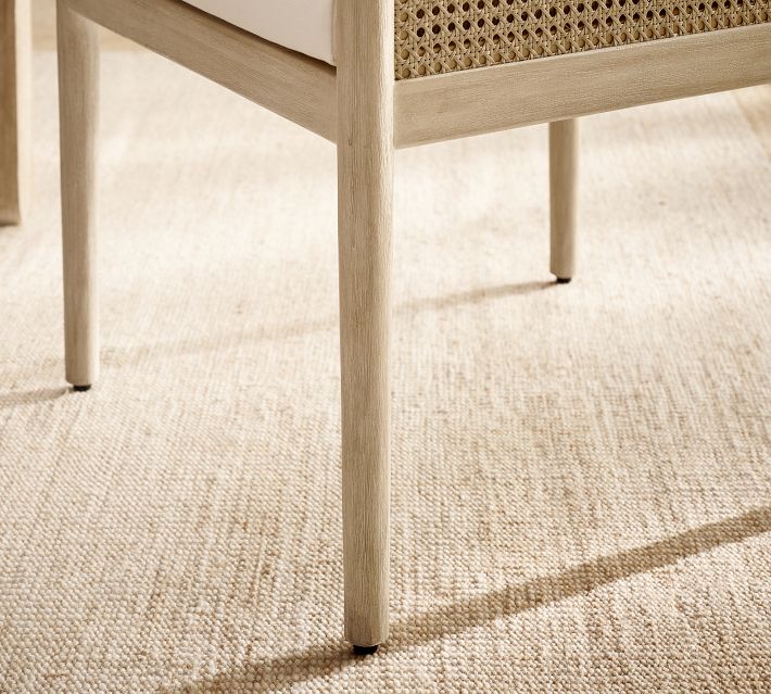 Close-up of chair leg and base on rug