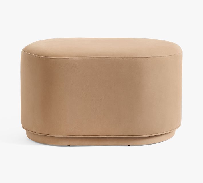 Large tan leather ottoman with rounded front and base visible