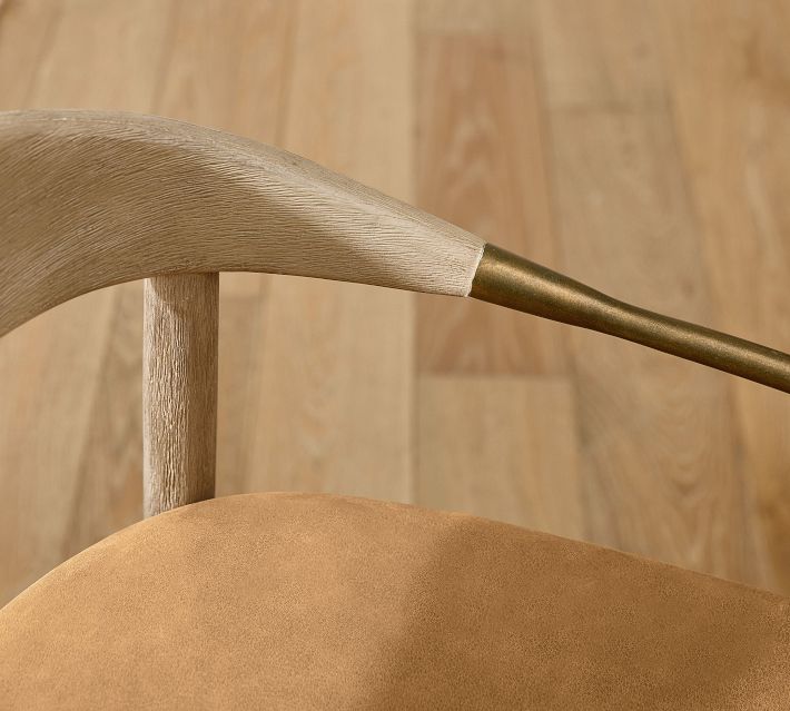 Close-up of chair backrest and leather seat with wooden frame