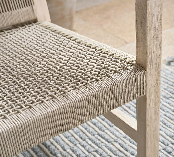 Edge and weave detail of the chair seat showing vertical cords and edge piping.