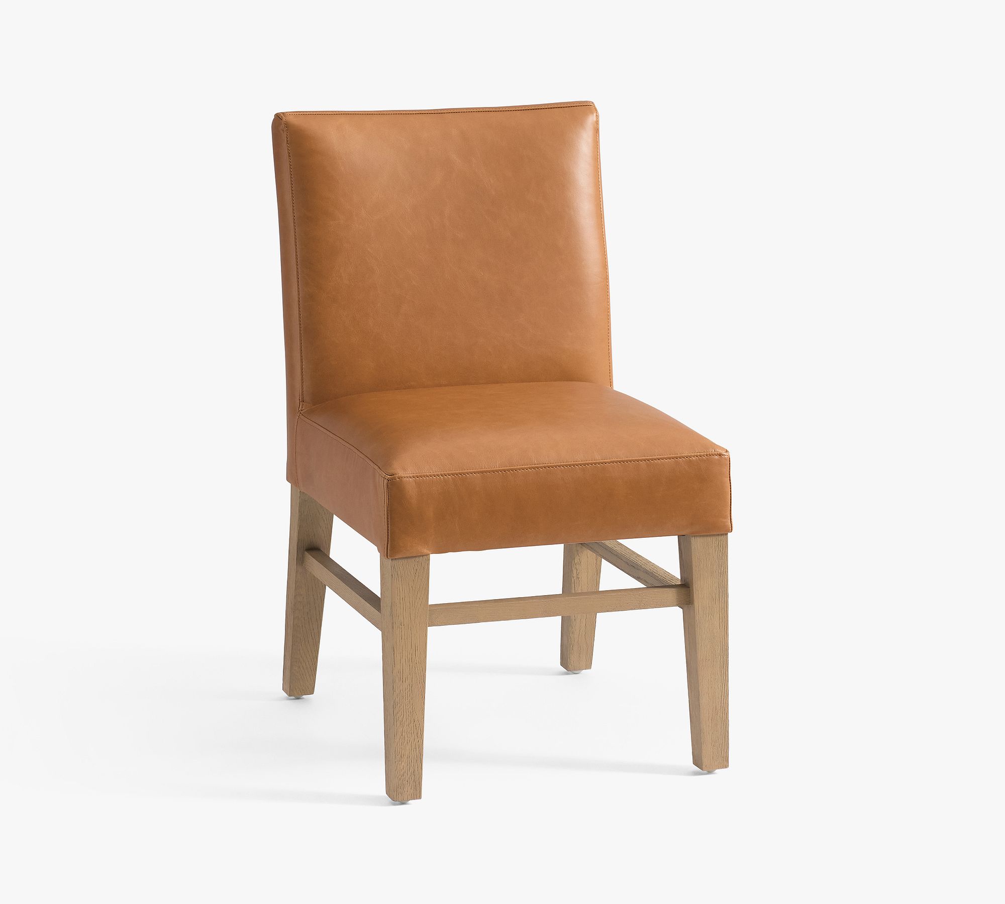 Side view of leather dining chair on white background
